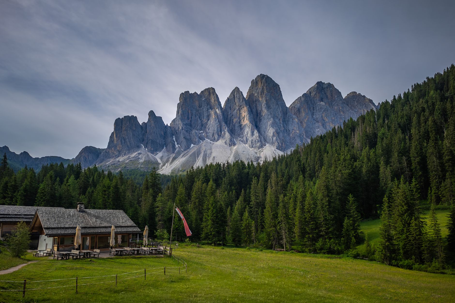 Dramatic Dolomite rock towers rising through clouds